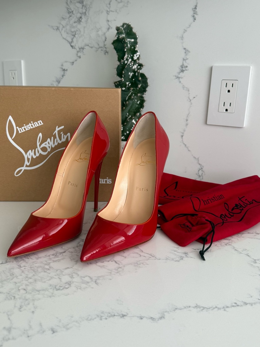 Christian Louboutin “So Kate” Red Patent Pumps